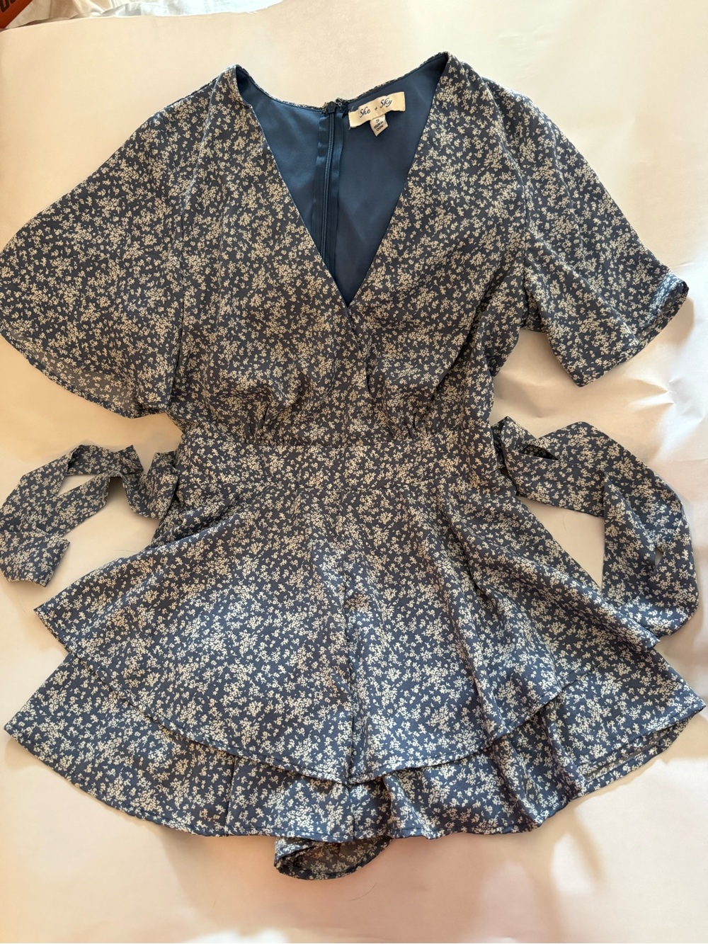 She + Sky She and Sky blue ruffled floral romper size S with tie